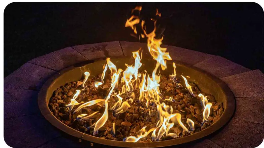 a fire pit is lit up at night