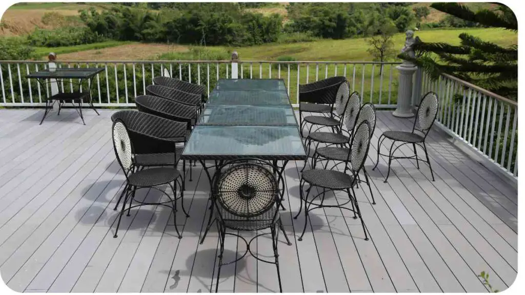 an outdoor dining table and chairs on a wooden deck