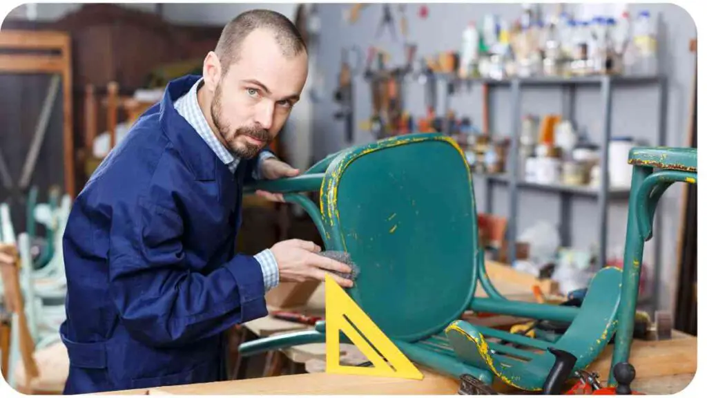 a person is working on a chair in a workshop